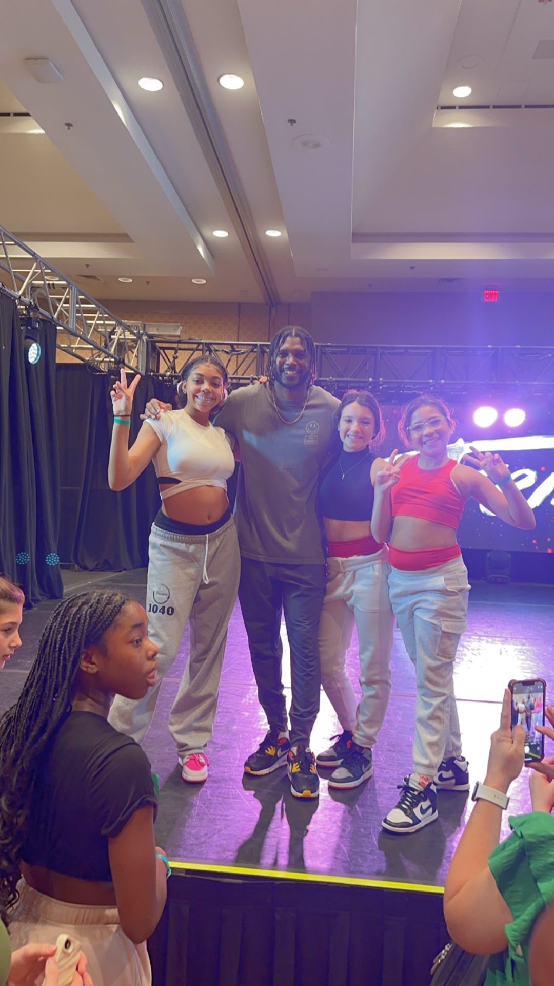 Premiere hip-hop dancers with a guest choreographer on stage.